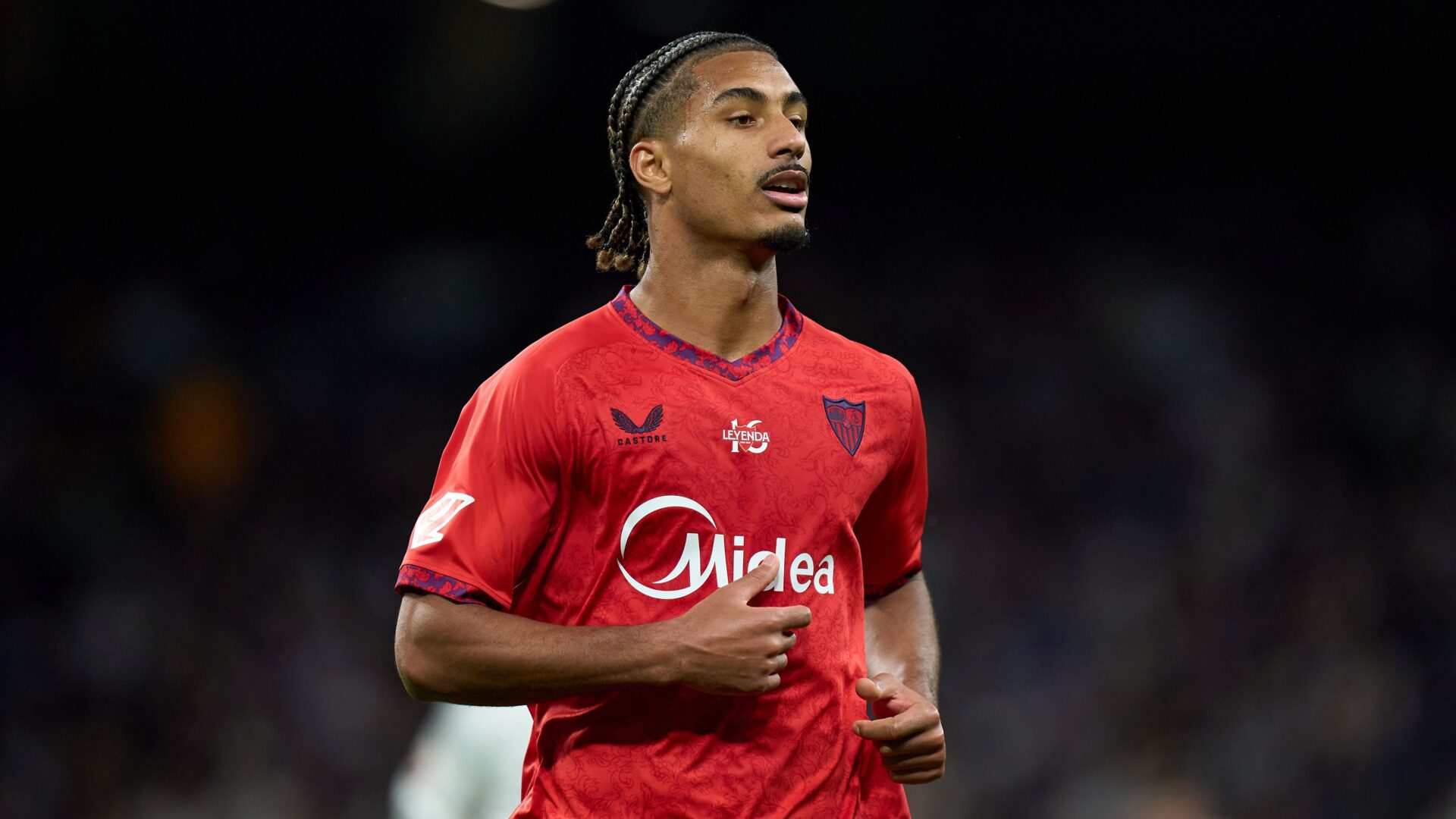Badé con la maglia del Siviglia